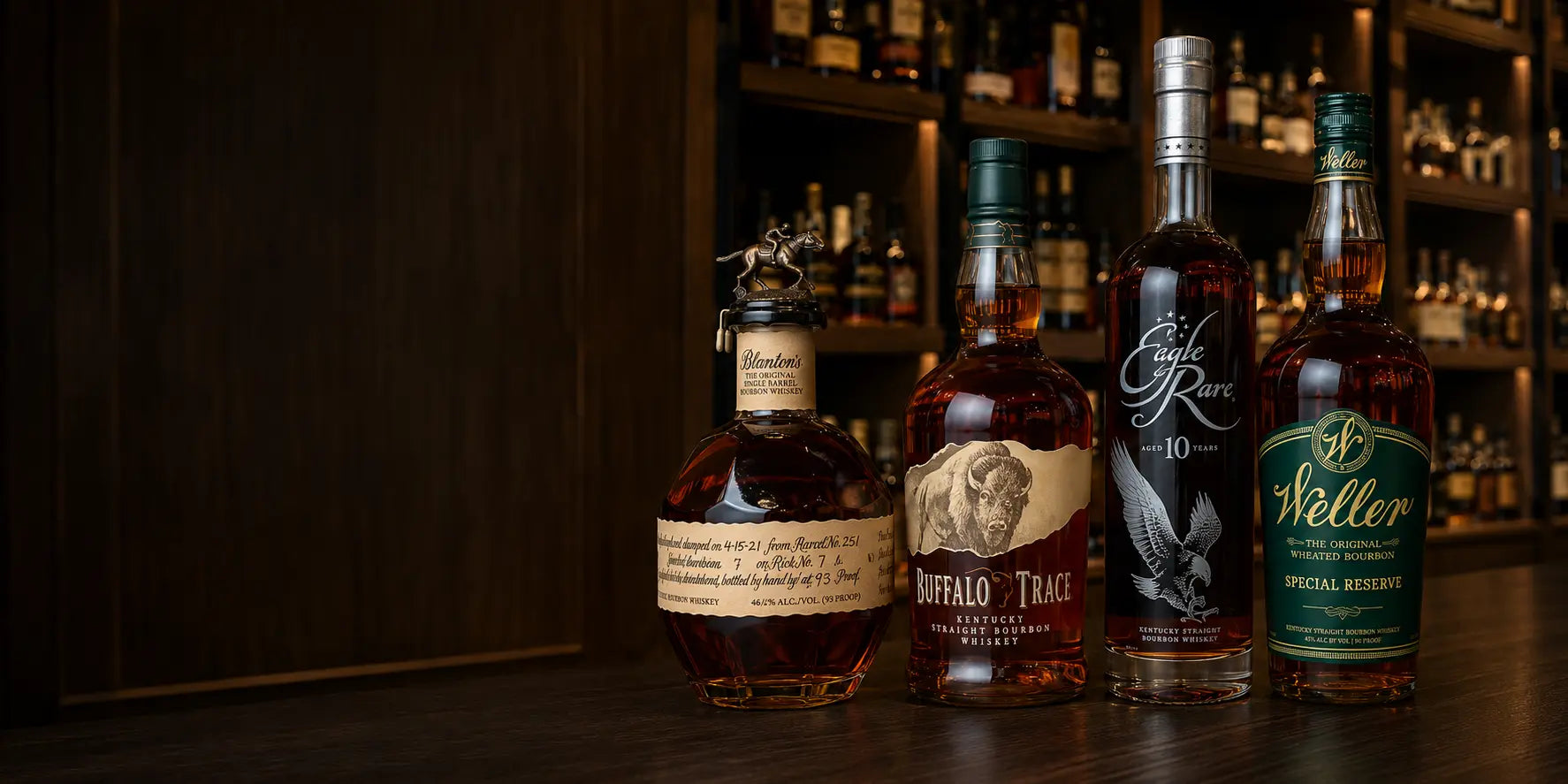 Blanton's, Buffalo Trace, Eagle Rare and Weller bourbon bottles displayed in a premium liquor store